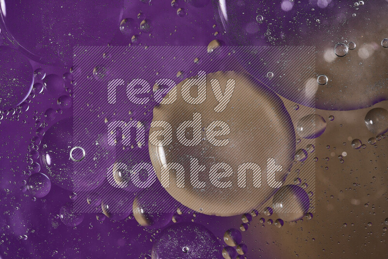 Close-ups of abstract oil bubbles on water surface in shades of purple and brown