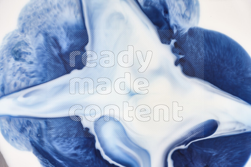 A close-up of abstract swirling patterns in blue and white