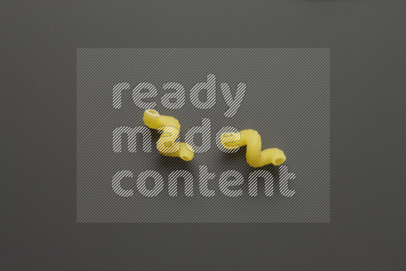 Twist pasta on grey background
