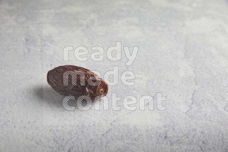 one madjoul date on a light grey background