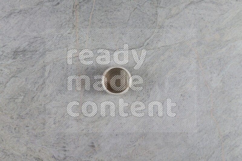 A multicolored pottery Bowl on grey marble background