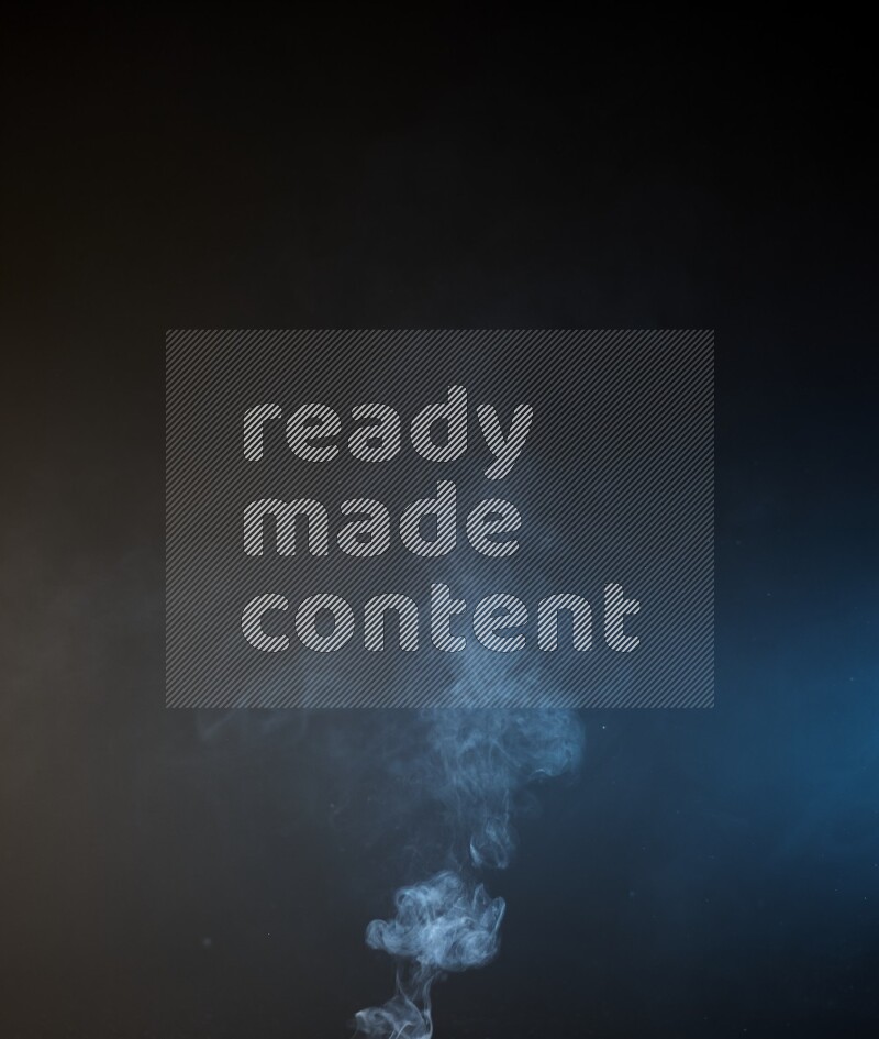 Heavy smoke in blue and yellow isolated on black background