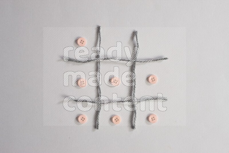 Rose buttons placed on grey background