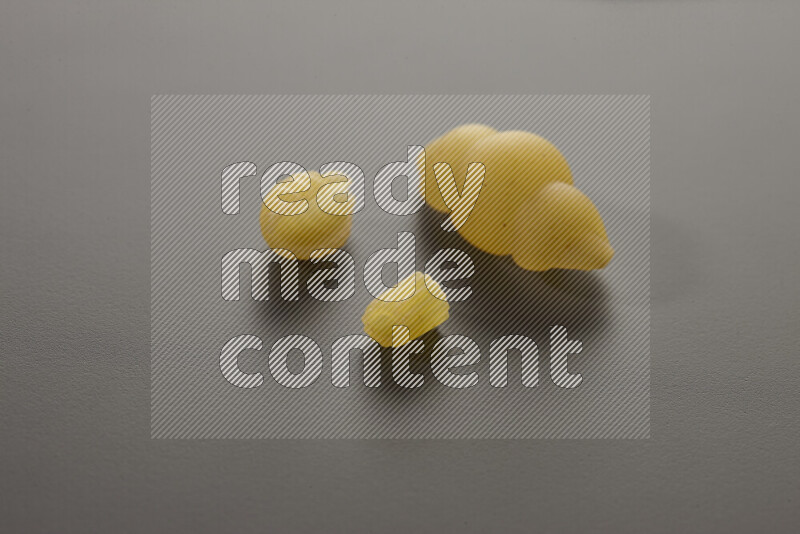 Different pasta types on grey background