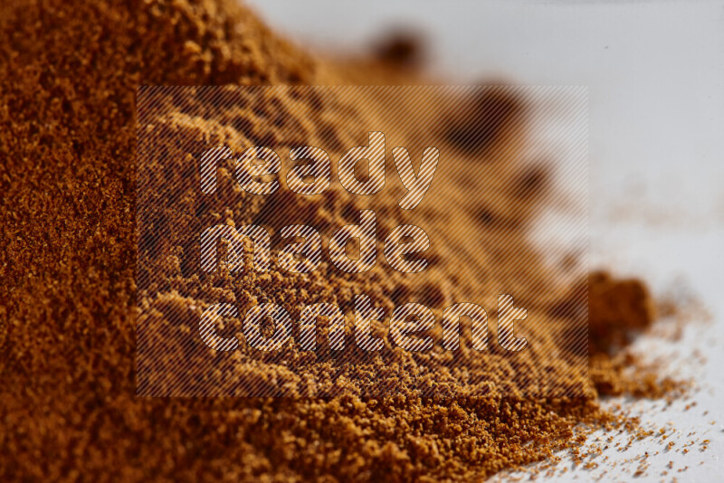A bunch of ground paprika powder on white background
