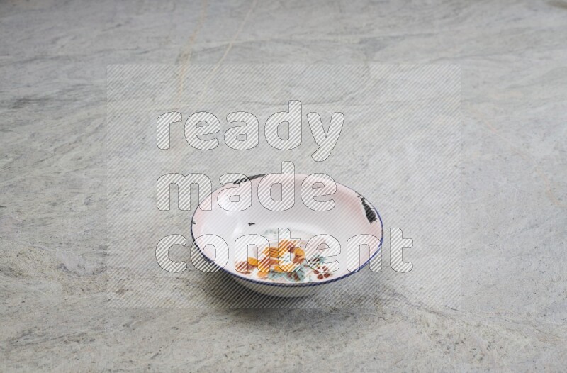 A vintage metal plate on grey marble background