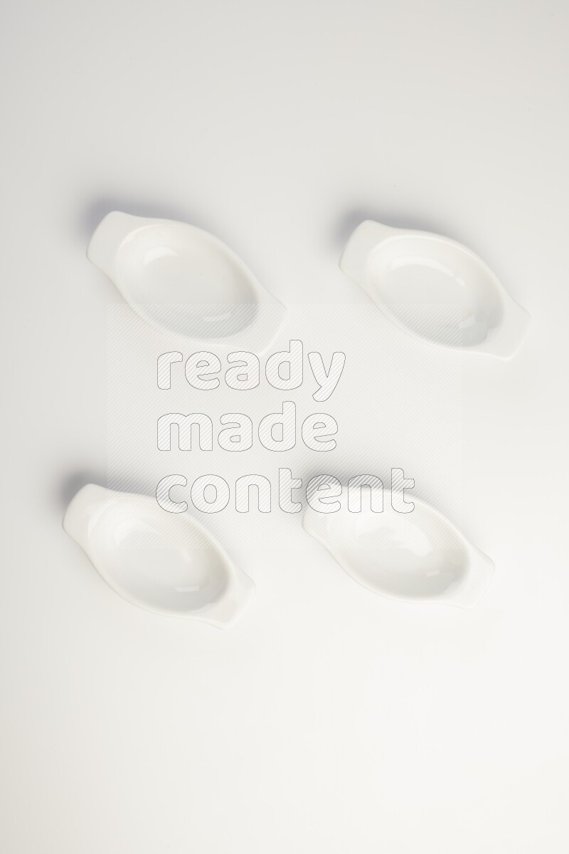 white ceramic oval sauce dish on white countertop