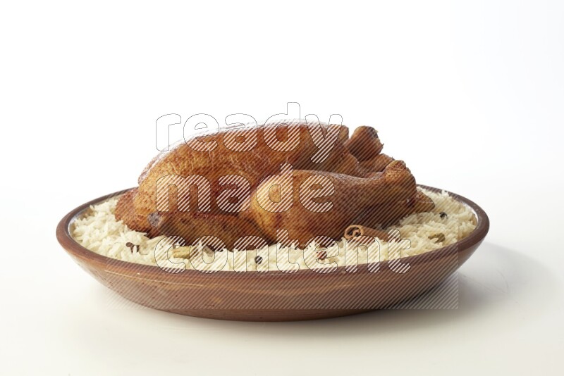 white  basmati Rice with  whole roasted chicken    on a pottery plate  direct  on white background