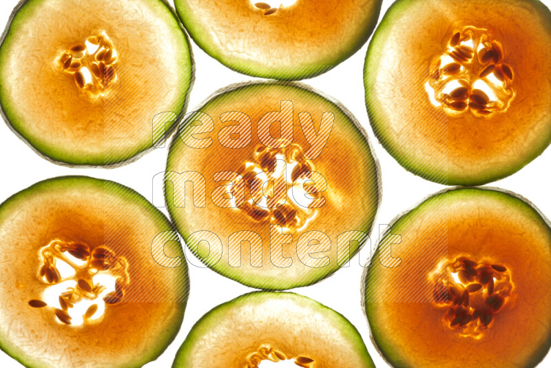 Cantaloupe slices on illuminated white background