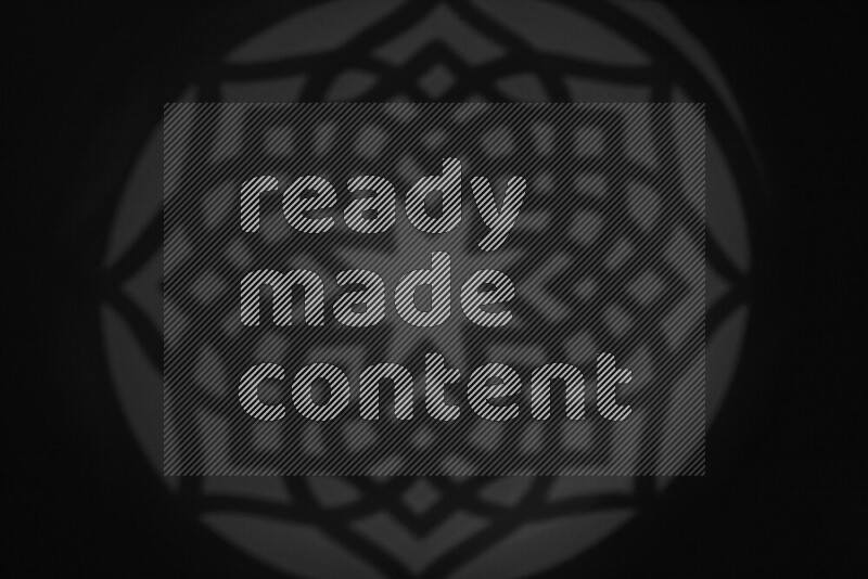 مجموعة من ضوء الغوبو الخافت تظهر أنماط هندسية علي سطح ناعم