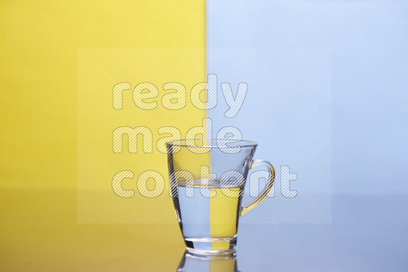 The image features a clear glassware filled with water, set against yellow and light blue background