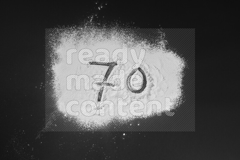 Numbers written with powder on black background