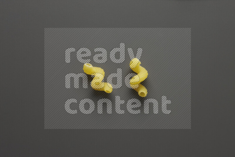Twist pasta on grey background