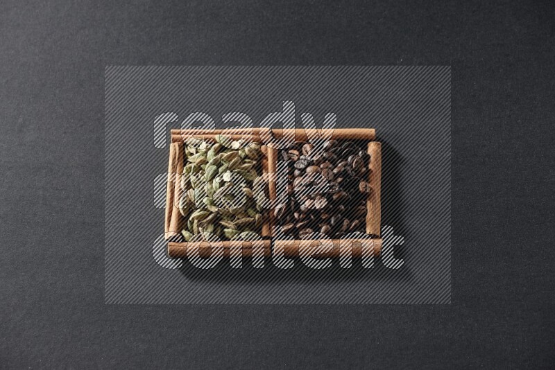 2 squares of cinnamon sticks full of coffee beans and cardamom on black flooring