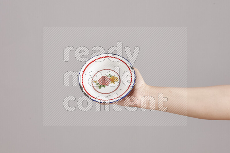 Woman hands holding different metal essentials in different positions
