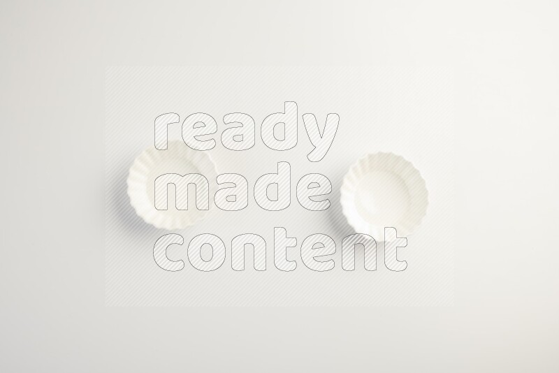 white ceramic round sauce dish on white countertop