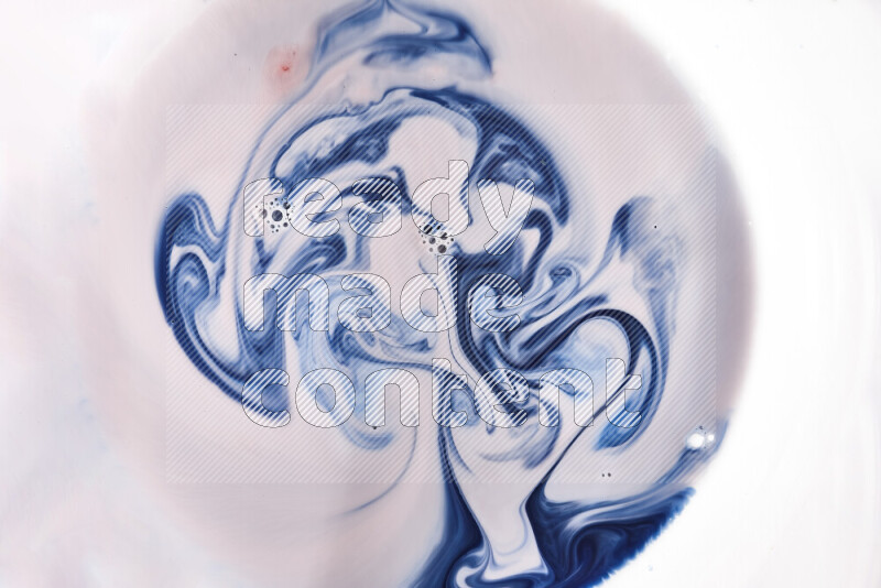 A close-up of abstract swirling patterns in blue, red and white