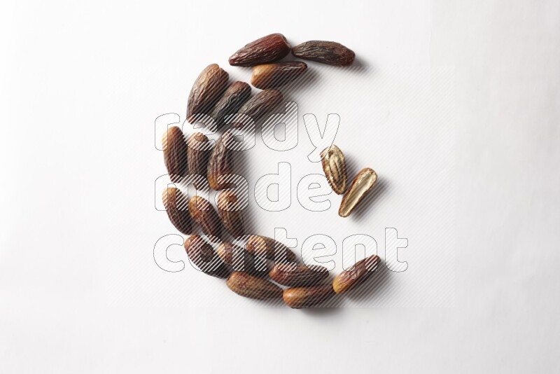 Dates in a crescent shape on white background