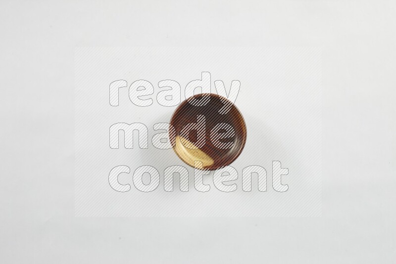 A wooden bowl on white background