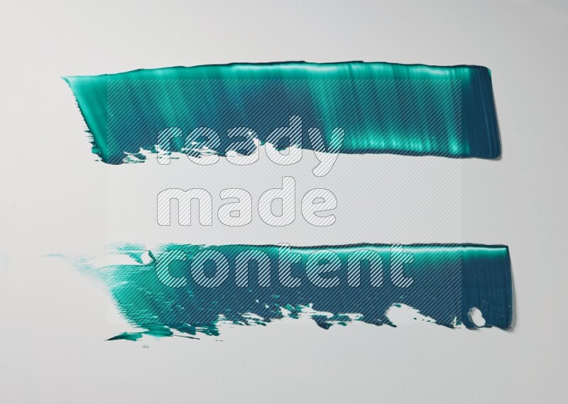 Turquoise painting knife strokes on white background