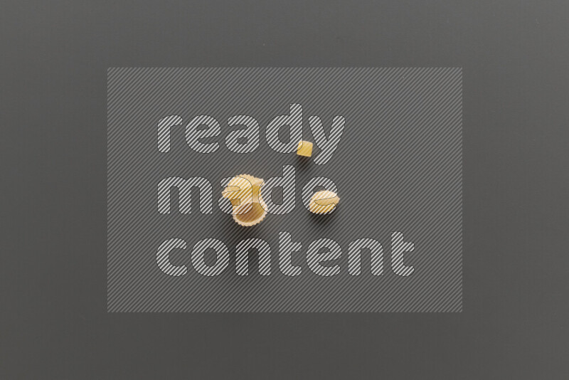 Different pasta types on grey background