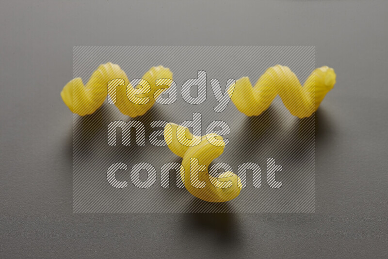 Twist pasta on grey background