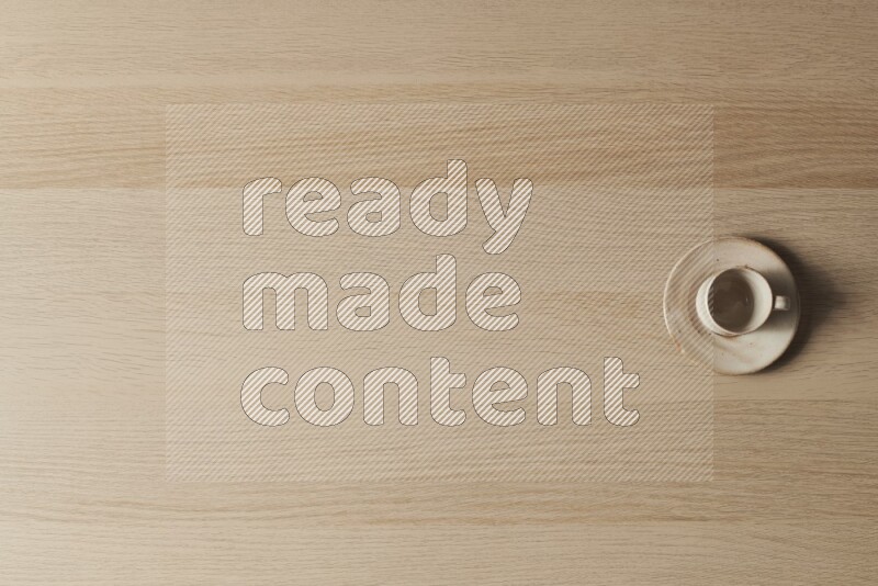 A pottery cup on light wooden background