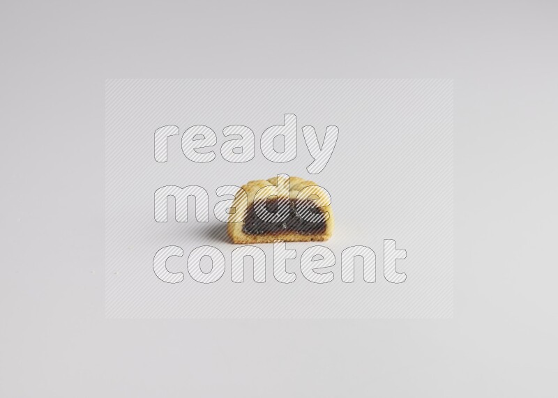 Half Maamoul filled with date direct on white background