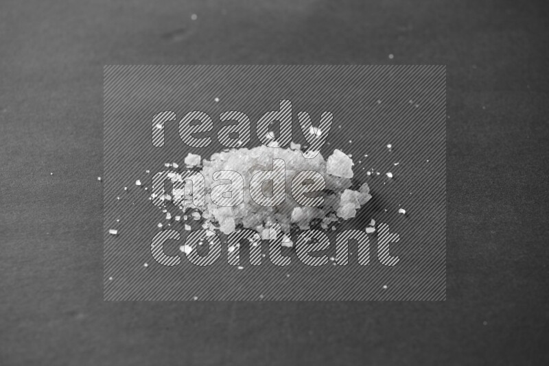 Salt on a black flooring