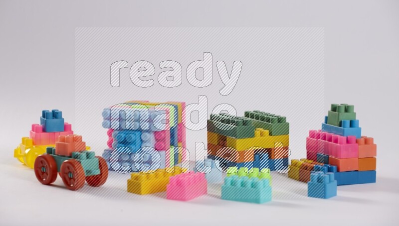 Collection of colorful different kids toys on white background