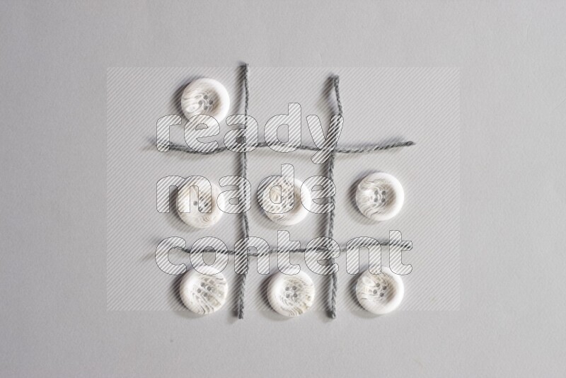 White buttons placed on grey background