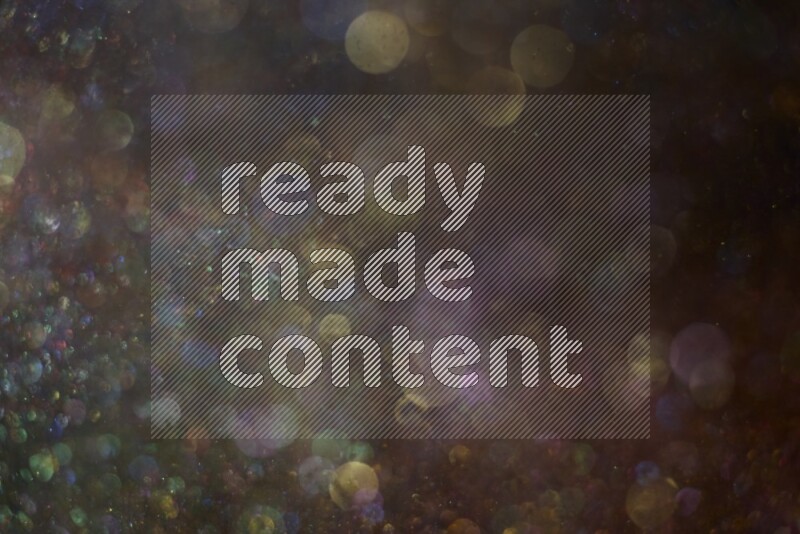 Multicolored glitter powder isolated on black background