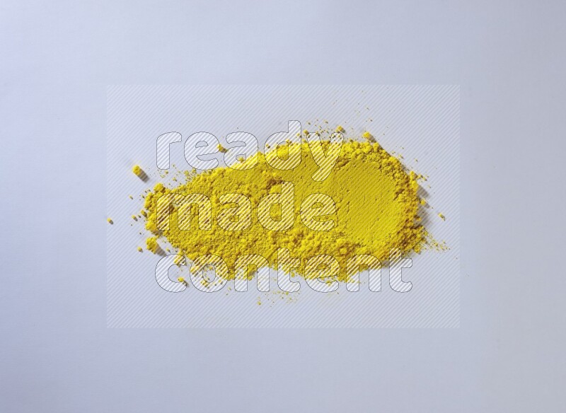 Yellow powder smears on white background
