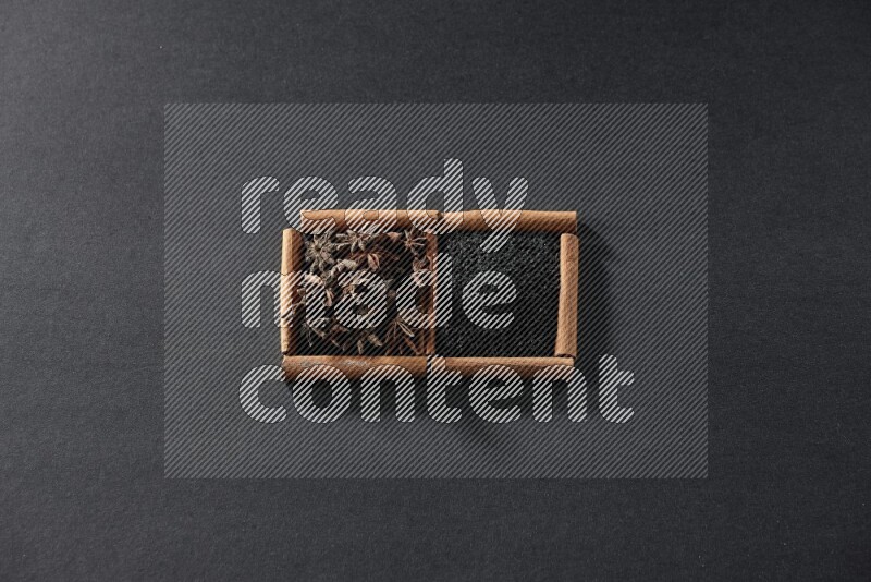 2 squares of cinnamon sticks full of black seeds and star anise on black flooring