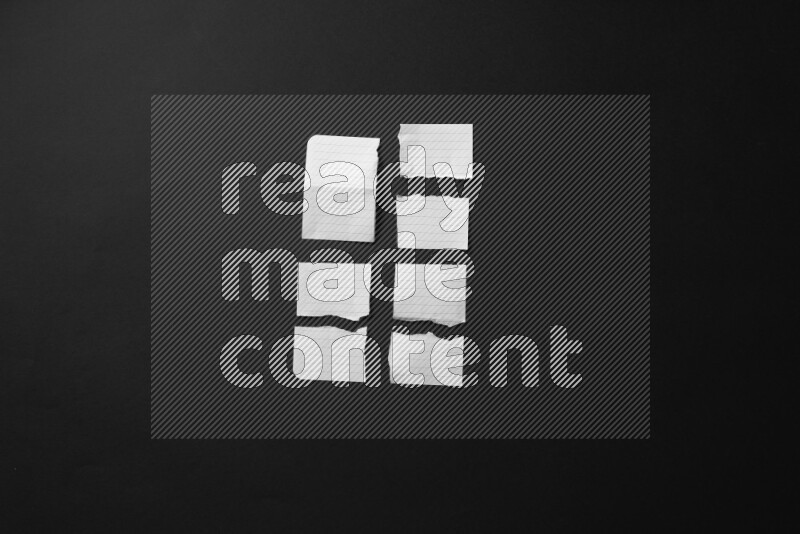 Ripped notebook sheet on black background