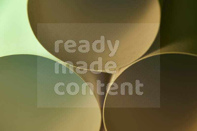 The image shows an abstract paper art with circular shapes in varying shades of green and warm tones