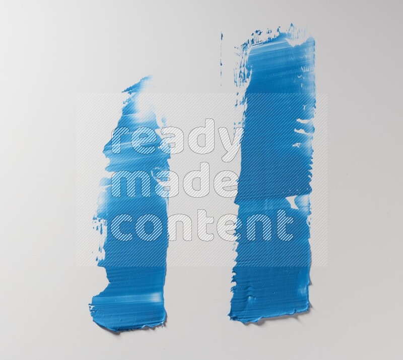 Blue painting knife strokes on white background