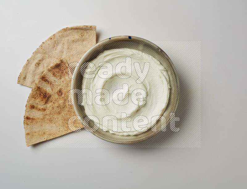 Plain Lebnah  in a grey pottery plate on a white background