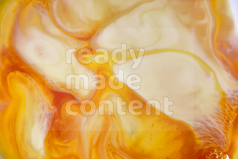 A close-up of abstract swirling patterns in orange, red and white