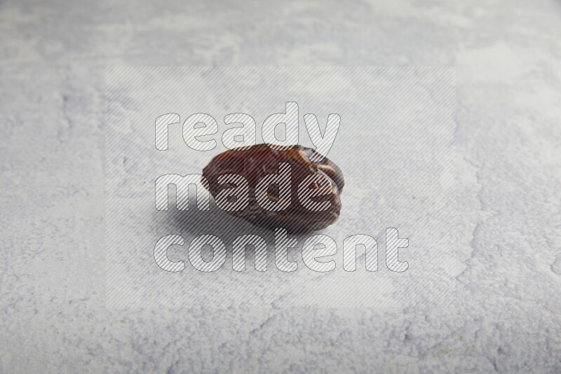 one madjoul date on a light grey background