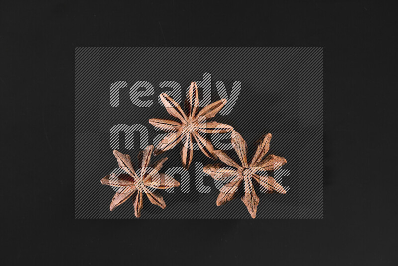 Star anise on black background