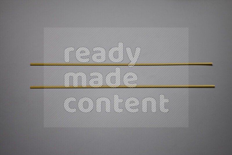 Linguini pasta on grey background