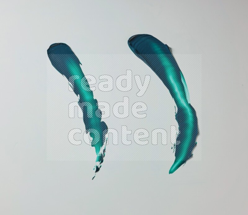 Turquoise curved painting knife strokes on white background
