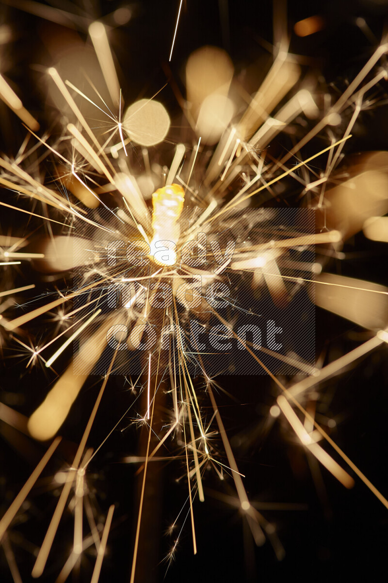 A close-up image of sparkler candle isolated on black background