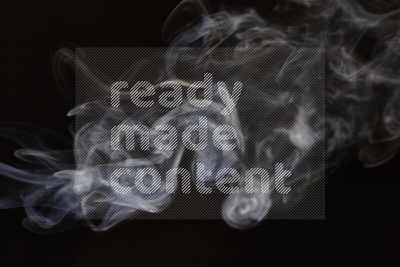 Motion of wavy smoke isolated on dark background