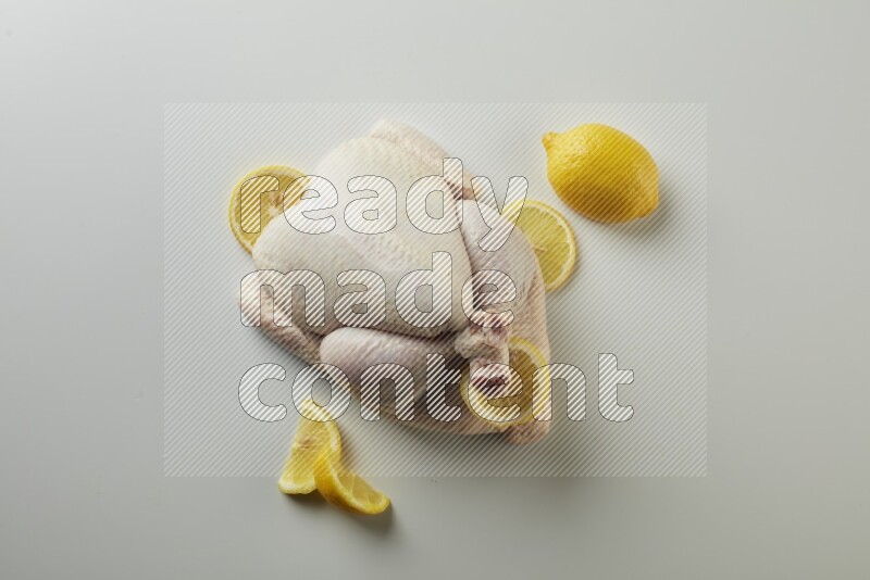 Whole fresh chicken direct on a white background