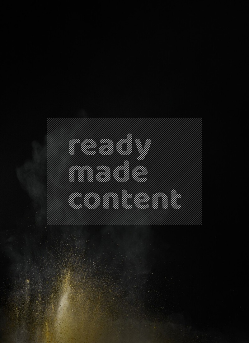 A side view of yellow powder explosion on black background