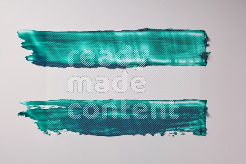Turquoise painting knife strokes on white background