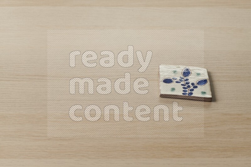 A decorative coaster on light wooden background