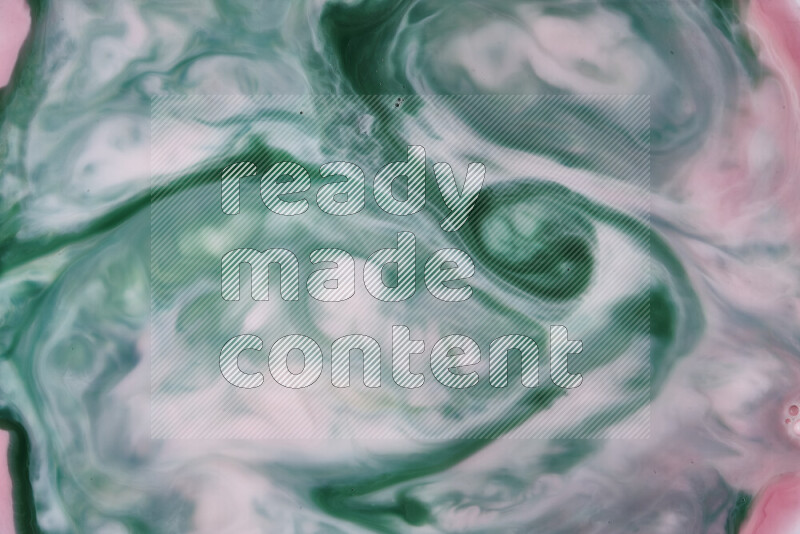 A close-up of abstract swirling patterns in red and green